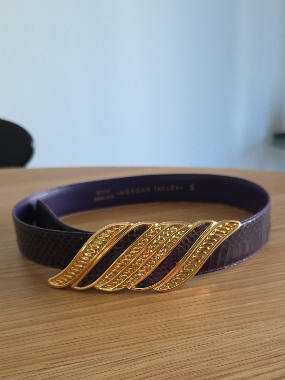Morgan Taylor purple snakeskin- belt features a prominent gold-tone buck